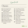 Ingredient list for large holiday cheese board displaying twenty gourmet cheeses including aged gouda, wensleydale, brie, and specialty varieties with festive cutouts.
