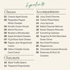 Ingredient list for medium Happy Holidays cheese and charcuterie board with nine cheeses including gingerbread and candy cane cutouts, two cured meats, and eleven accompaniments.