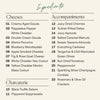 Ingredient list for New Years cheese and charcuterie board with nine specialty cheeses, two cured meats, and eleven accompaniments.