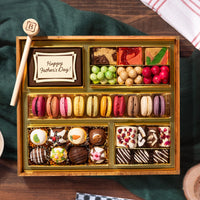 Assorted chocolate box on a wood background