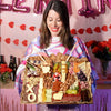 Cheese board for Valentine’s Day featuring gourmet cheeses, meats, nuts, and heart-shaped cheese cutouts with XO lettering.